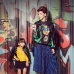 Skirt by Jamie Wei Huang,T-shirt by Laurence & Chico and leather jacket by Omelya, available at Boutique 51. Earrings & cuff available at Maison 69.