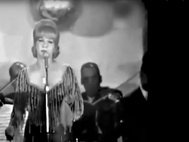 Shadia singing on stage